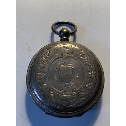 514 - AN 800 SILVER POCKET WATCH WITH SUB DIAL, DECORATIVE WHITE ENAMEL FACE, ROMAN NUMERALS AND A KEY