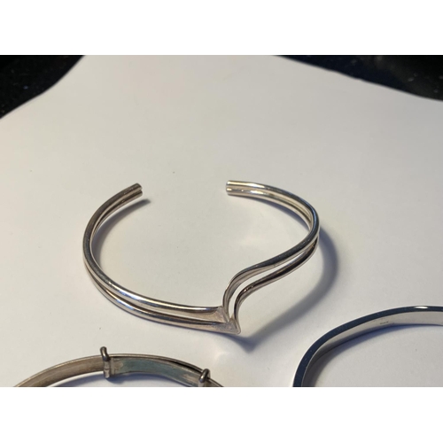 611 - THREE SILVER BANGLES