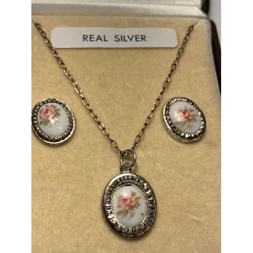 631 - A SILVER NECKLACE AND EARRING SET IN A PRESENTATION BOX