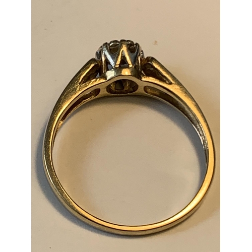 648 - A 9 CARAT GOLD RING WITH A DIAMOND SOLITAIRE SIZE