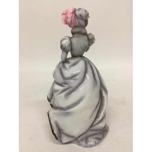 711 - A ROYAL WORCESTER FIGURINE 