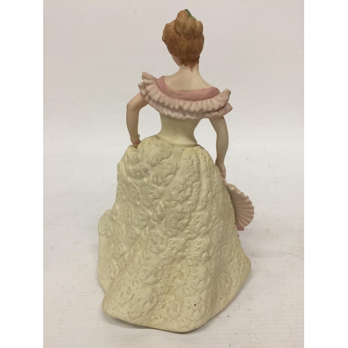 712 - A WEDGWOOD FIGURINE 