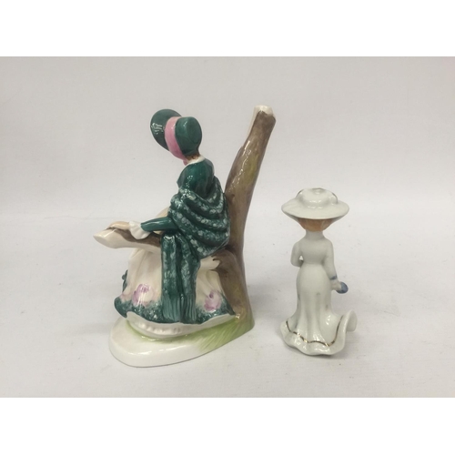 750 - A FINE BONE CHINA FIGURE OF A LADY SITTING IN A BRANCH 