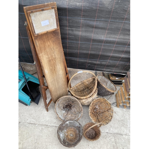 2072 - AN ASSORTMENT OF WICKER BASKETS AND A WOODEN IRONING BOARD