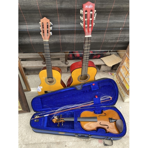 2075 - TWO CHILDS ACOUSTIC GUITARS AND A CASED VIOLIN