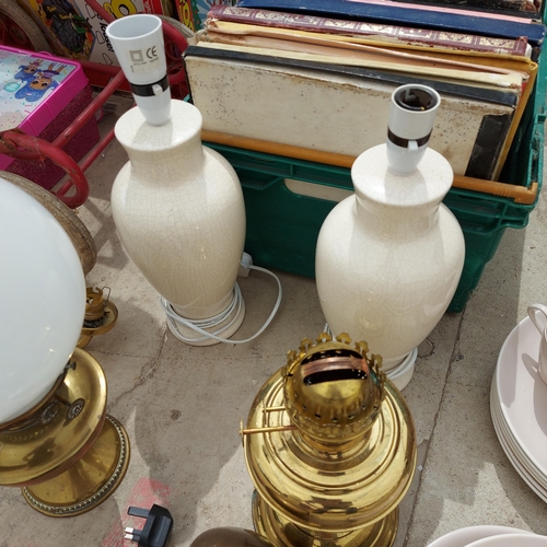 2133 - AN ASSORTMENT OF LAMPS TO INCLUDE TWO BRASS OIL LAMPS ETC