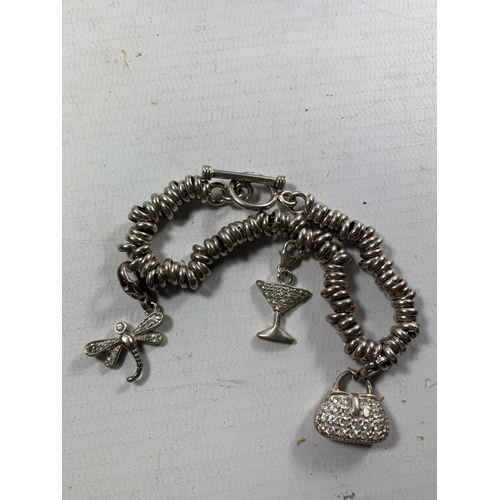 442 - A SILVER SWEETY BRACELET WITH THREE CHARMS