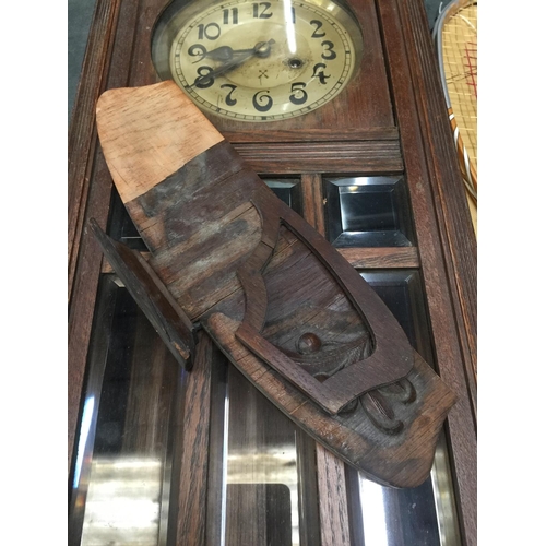 845 - A VINTAGE MAHOGANY CASED WALL CLOCK WITH BEVELLED GLASS TO THE FRONT, COMPLETE WITH PENDULUM AND KEY... 