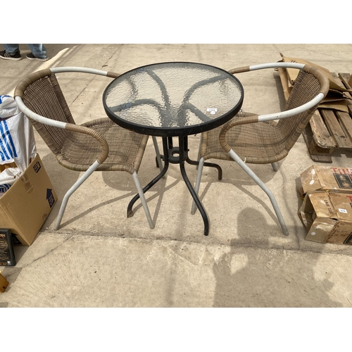 A GLASS TOPPED BISTRO TABLE AND TWO WICKER EFFECT CHAIRS