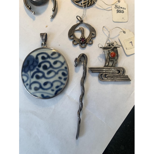 671 - SEVEN SILVER ITEMS TO INCLUDE FIVE PENDANTS