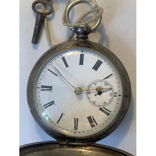 682 - A MARKED 800 SILVER POCKET WATCH WITH WHITE ENAMEL FACE, ROMAN NUMERALS, SUB DIAL AND KEY