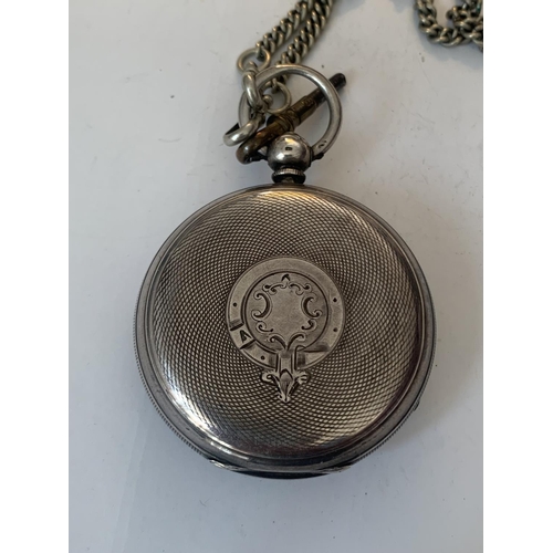 685 - A HALLMARKED LONDON SILVER POCKET WATCH WITH DECORATIVE DIAL, ROMAN NUMERALS, SUB DAIL AND KEY ON A ... 