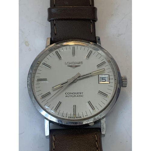 686 - A VINTAGE LONGINES CONQUEST AUTOMATIC WRIST WATCH WITH LEATHER STRAP SEEN WORKING BUT NO WARRANTY