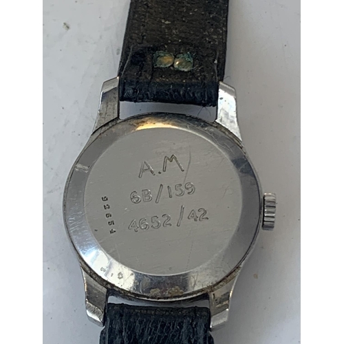 690 - A VINTAGE JAEGER LeCOUTRE WRIST WATCH WITH WHITE FACE AND BLACK LEATHER STRAP POSSIBLY MILITARY. SEE... 