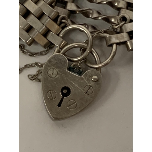 615 - A SILVER FIVE BAR GATE BRACELET WITH HEART PADLOCK FASTEN