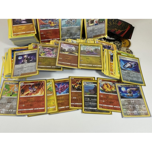 104 - APPROXIMATELY 350 POKEMON CARDS IN A TRAINER BOX, HOLOS, GAME COUNTERS ETC