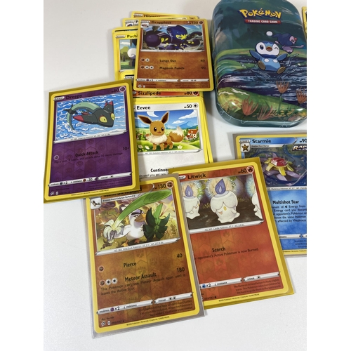 332 - A TIN OF ASSORTED POKEMON CARDS, HOLOS ETC