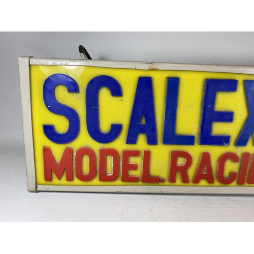 305 - A SCALEXTRIC MODEL RACING CARS ILLUMINATED BOX SIGN, 22.5 X 63.5CM