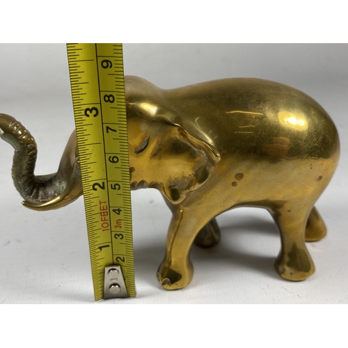 352 - A VINTAGE ORIENTAL SOLID BRASS MODEL OF AN ELEPHANT, HEIGHT 9CM