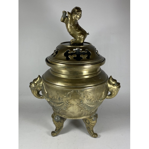 354 - A LARGE CHINESE TWIN HANDLED BRASS LIDDED TEMPLE JAR, WITH DRAGONS CHASING THE FLAMING PEARL MYTHIC ... 