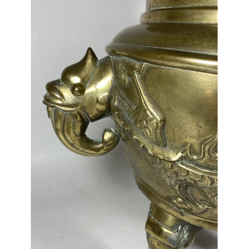 354 - A LARGE CHINESE TWIN HANDLED BRASS LIDDED TEMPLE JAR, WITH DRAGONS CHASING THE FLAMING PEARL MYTHIC ... 