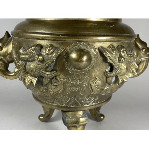 354 - A LARGE CHINESE TWIN HANDLED BRASS LIDDED TEMPLE JAR, WITH DRAGONS CHASING THE FLAMING PEARL MYTHIC ... 