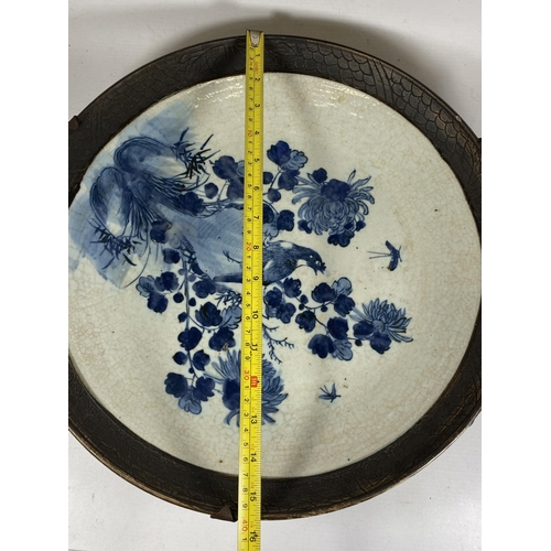 374 - A LARGE CHINESE CRACKLE GLAZE BLUE AND WHITE FLORAL CHARGER, A/F, DIAMETER 39CM