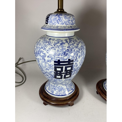 377 - A PAIR OF CHINESE BLUE AND WHITE PORCELAIN MARRIAGE JAR DESIGN TABLE LAMPS, HEIGHT INCLUDING FITTING... 