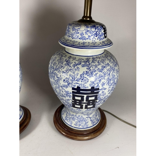 377 - A PAIR OF CHINESE BLUE AND WHITE PORCELAIN MARRIAGE JAR DESIGN TABLE LAMPS, HEIGHT INCLUDING FITTING... 