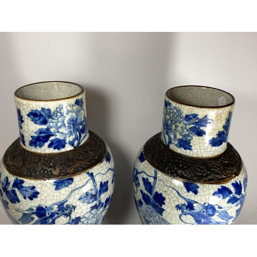 378 - A PAIR OF EARLY 20TH CENTURY CHINESE BLUE AND WHITE CRACKLE GLAZE DRAGON DESIGN VASES, A/F, HEIGHT 3... 