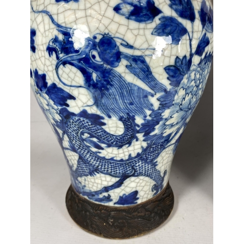 378 - A PAIR OF EARLY 20TH CENTURY CHINESE BLUE AND WHITE CRACKLE GLAZE DRAGON DESIGN VASES, A/F, HEIGHT 3... 