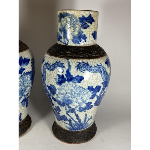 378 - A PAIR OF EARLY 20TH CENTURY CHINESE BLUE AND WHITE CRACKLE GLAZE DRAGON DESIGN VASES, A/F, HEIGHT 3... 