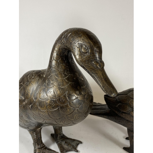 395 - A PAIR OF ORIENTAL SPELTER DUCK MODELS, UNSIGNED, HEIGHT 27CM