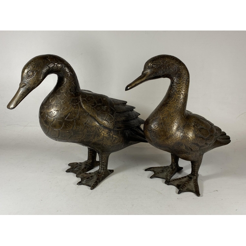 395 - A PAIR OF ORIENTAL SPELTER DUCK MODELS, UNSIGNED, HEIGHT 27CM