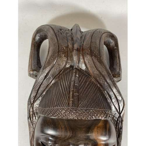 396 - A VINTAGE CARVED AFRICAN TRIBAL WALL MASK, LENGTH 37CM