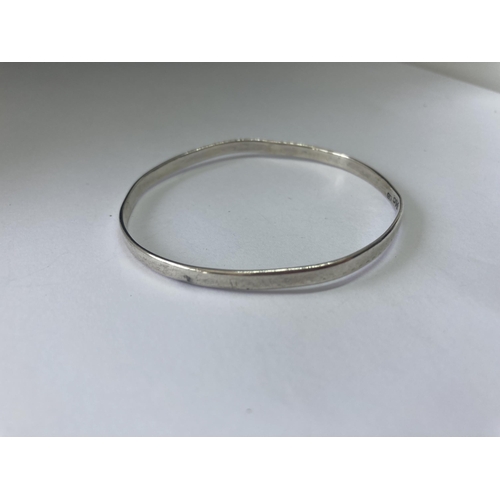 529 - A HALLMARKED CHESTER SILVER CHARLES HORNER BANGLE