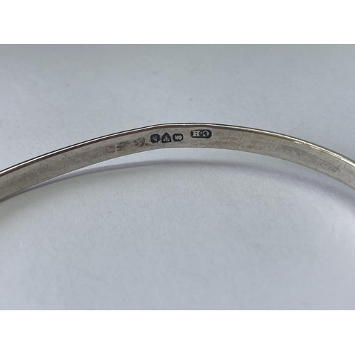 529 - A HALLMARKED CHESTER SILVER CHARLES HORNER BANGLE