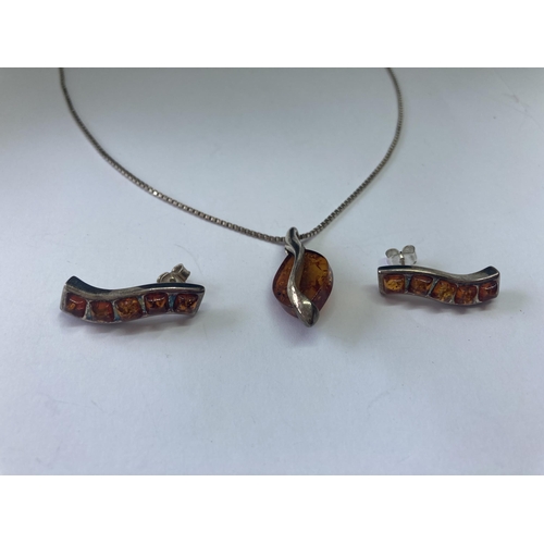 549 - A SILVER AND AMBER NECKLACE SET