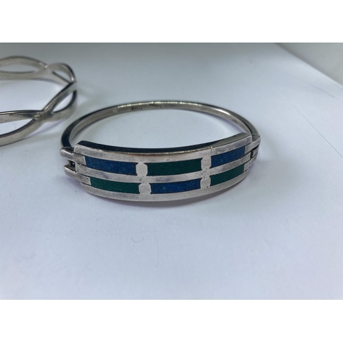 553 - TWO SILVER BANGLES