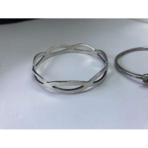 553 - TWO SILVER BANGLES