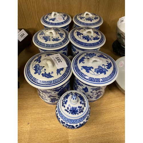 385 - A GROUP OF MODERN CHINESE BLUE AND WHITE ITEMS - LIDDED JAR AND SET OF SIX LIDDED MUGS