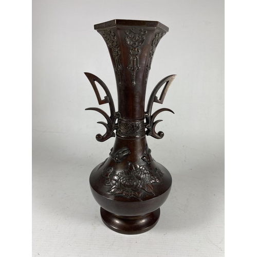 398 - A JAPANESE BRONZE TWIN HANDLED VASE, UNMARKED TO BASE, HEIGHT 28CM