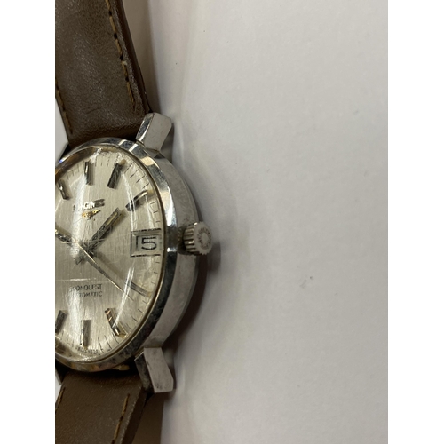 516 - A VINTAGE LONGINES CONQUEST AUTOMATIC WRIST WATCH WITH LEATHER STRAP SEEN WORKING BUT NO WARRANTY