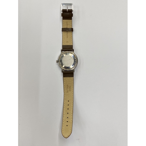 516 - A VINTAGE LONGINES CONQUEST AUTOMATIC WRIST WATCH WITH LEATHER STRAP SEEN WORKING BUT NO WARRANTY