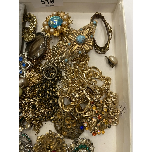 519 - A BOX OF ASSORTED COSTUME JEWELLERY TO INCLUDE YELLOW METAL NECKLACES, WHITE METAL DOVE BUTTONS ETC