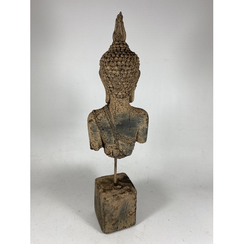 414 - A DECORATIVE STONE BUDDHA ON METAL POLE AND SQUARE BASE, HEIGHT 39CM