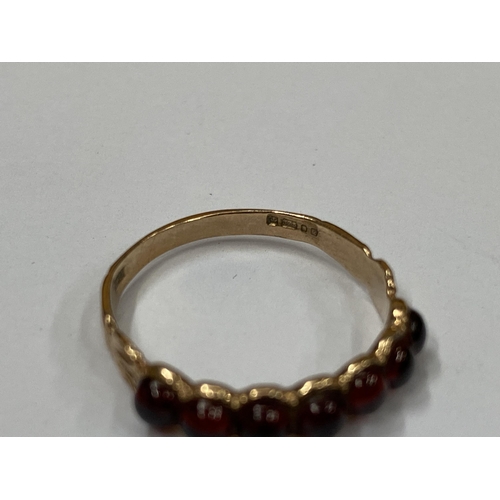 501 - A 9CT YELLOW GOLD WITH SEVEN GARNET SET STONES, WEIGHT 1.63G