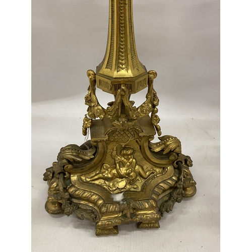 21 - A VINTAGE BRASS FIVE BRANCH CANDLEABRA WITH CHERUB DESIGN BASE, HEIGHT 47CM