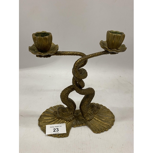 23 - A VINTAGE BRASS TWIN DOPLHINS CANDLESTICK, HEIGHT 19CM