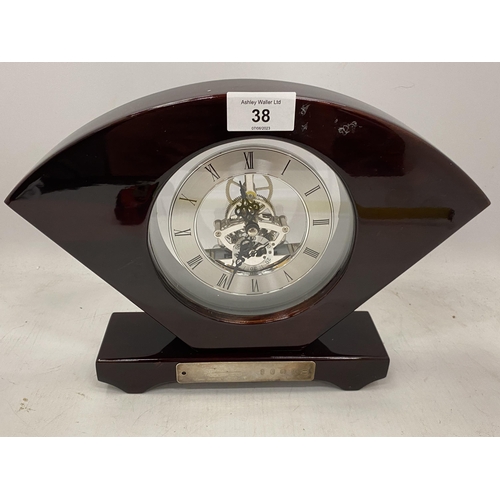 38 - A WOODEN CASED SKELETON MANTLE CLOCK WITH HALLMARKED SILVER PRESENTATION PLAQUE, HEIGHT 22CM